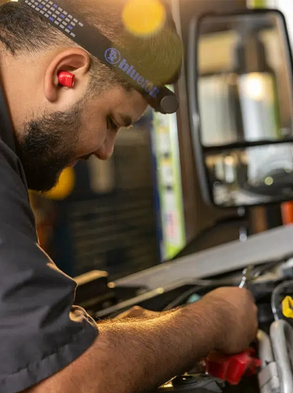 a mechanic working on an engine