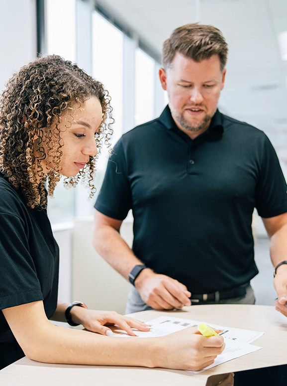 woman and man looking at forms for renting a vehicle in Chicago